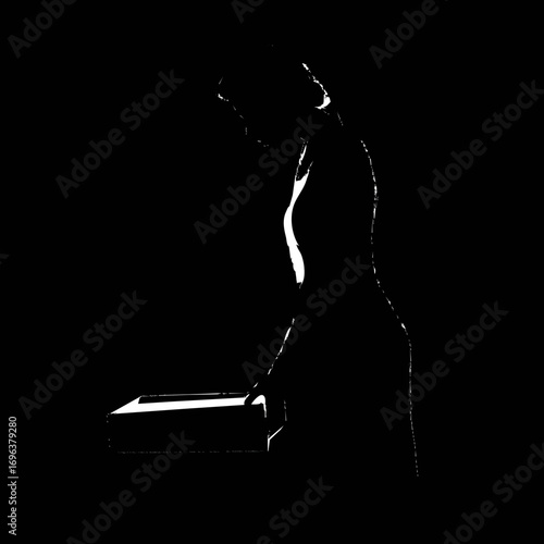 Silhouette of a person interacting with a box in an artistic black and white composition