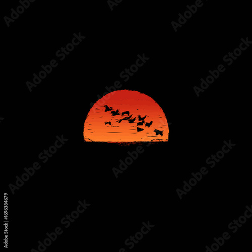 Colorful sunset with silhouettes of birds flying across a vibrant sky during twilight hours