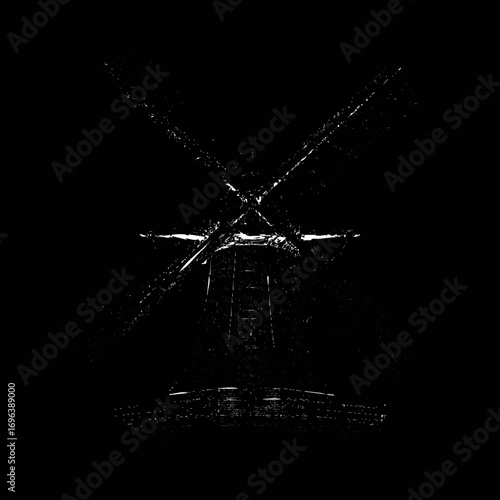Windmill silhouette against a dark background creating a dramatic effect at night