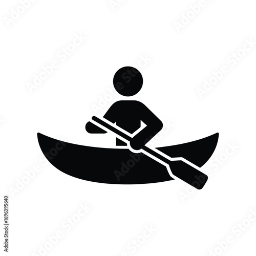 Silhouette of a person canoeing with a paddle