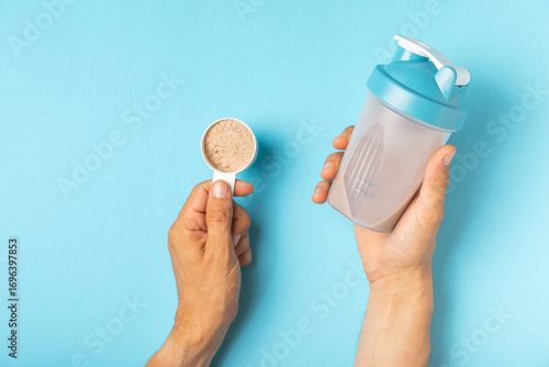 Protein powder. protein shake. Shaker bottle with protein. Food supplement. Whey protein powder with shaker for mixing. Sports nutrition. Concept of sports and healthy lifestyle. Sports equipment