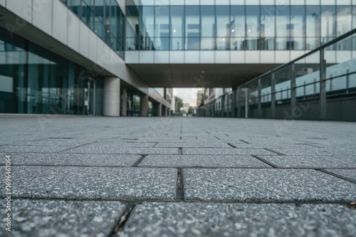 Empty gray tiled pavement s...