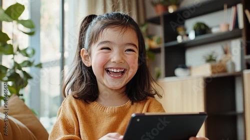 Joyful Child Using Tablet