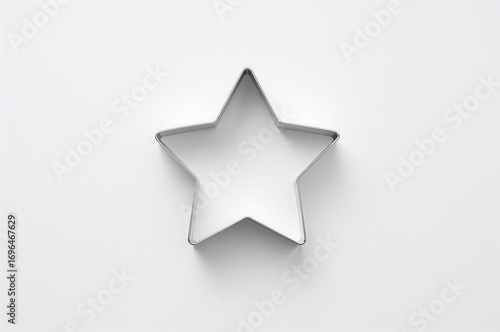 Cookie cutter against a whi...
