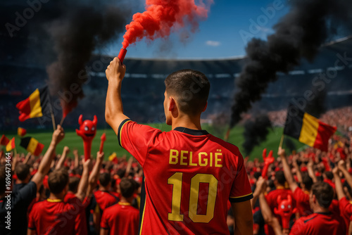 Belgian male fan in red België jersey celebrating with flare