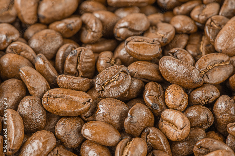 Fototapeta premium Roasted coffee beans as a background macro photo.