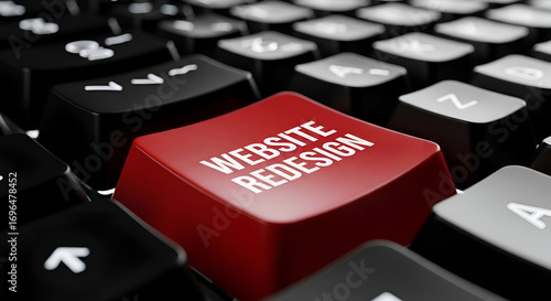 Website redesign concept with red keyboard button and text