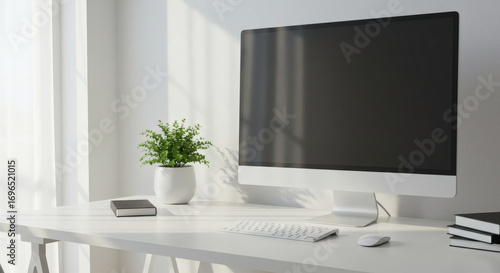 Minimalist home office setup with desktop monitor, keyboard, and neutral background, plant for accent, clean and modern atmosphere, negative space on the left for copy