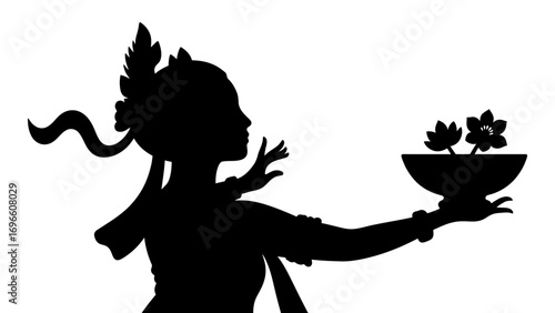 silhouette of a Balinese dancer holding a floral offering bowl, representing devotion and culture