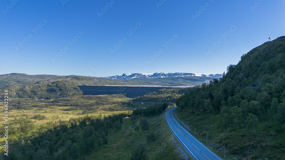 Obraz premium Aerial View of Hardangervidda Dam and Mountain Road in the Norwegian Highlands