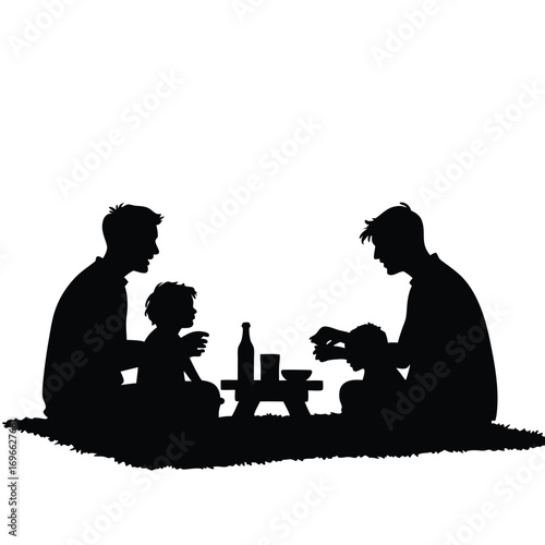Two fathers and children having a picnic silhouette on grass Keywords: family, picnic