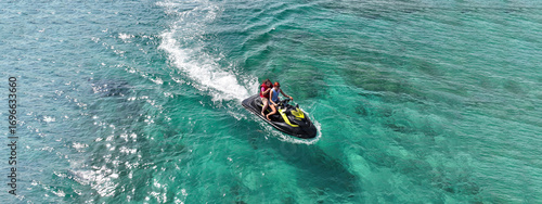 Фотография Aerial drone ultra wide top down photo of couple in watercraft cruising in low s