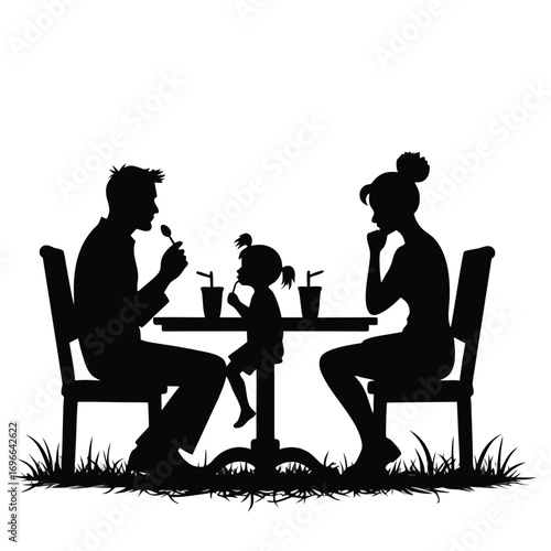 Family silhouette dining at outdoor cafe table with drinks