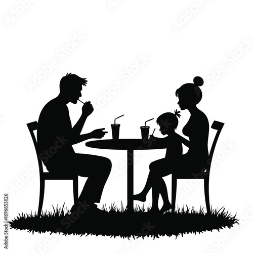 Father feeding daughter at outdoor cafe table silhouette Keywords: family, silhouette, eating