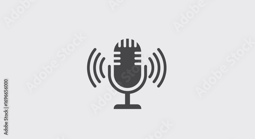 A simple dark grey microphone icon with radiating sound waves represents audio recording, broadcasting, or podcasting on a clean light grey background.