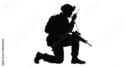 a soldier silhouette kneeling while communicating through radio equipment