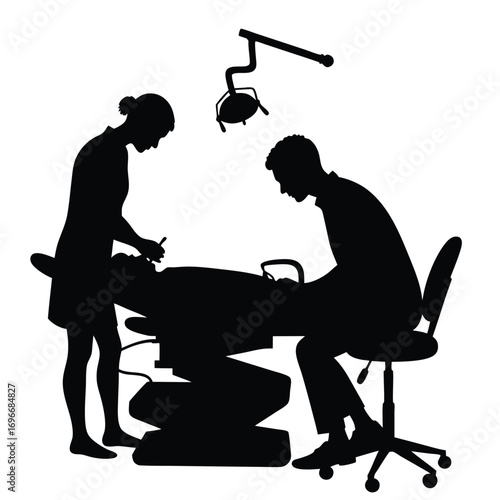 Dentist and assistant silhouette treating patient in dental chair