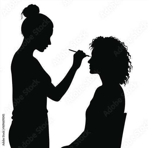 Makeup Artist Applying Makeup to Client Silhouette