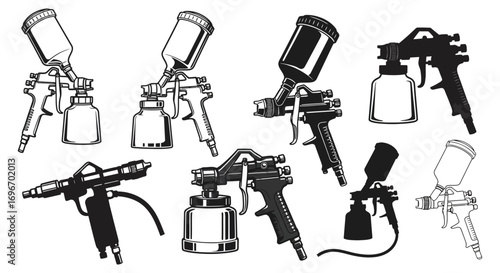various paint spray guns displayed in artistic arrangement silhouette
