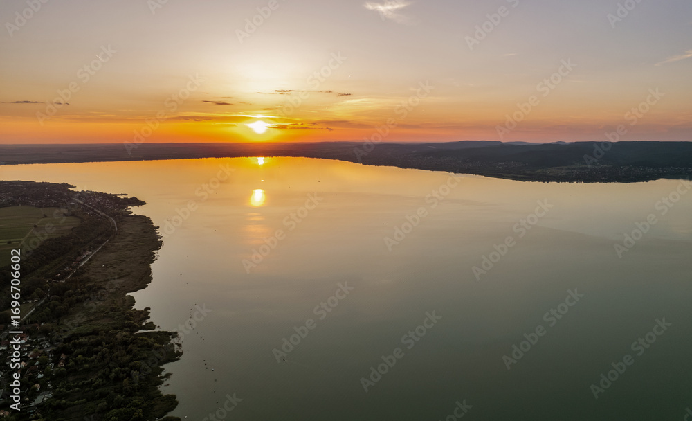 Fototapeta premium Spectacular sunset over lake Balaton with golden reflections, Hungary.