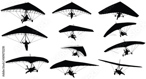 paragliders soaring high in sky with silhouette
