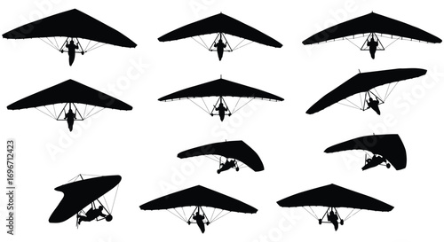 paragliders soaring high in sky with silhouette