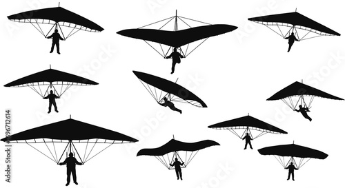 paragliders soaring high in sky with silhouette