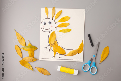 Billede på lærred creative mix of nature and fantasy with yellow leaves forming imaginative creatu