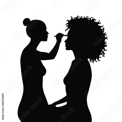 Woman applying makeup to woman's face silhouette application