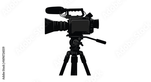a professional video camera setup on tripod silhouette
