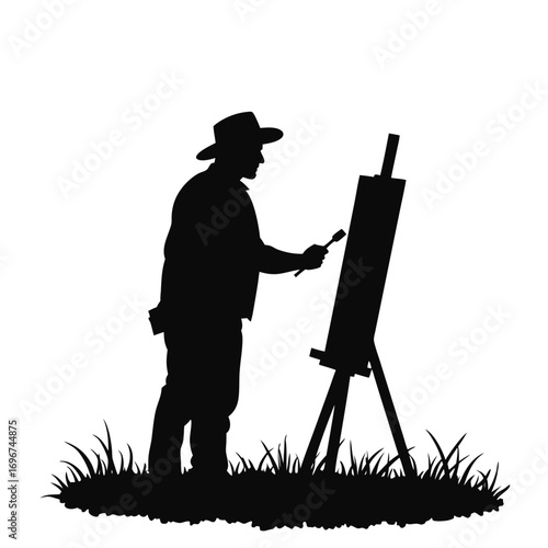 Silhouette of a man with a hat painting on an easel on a white background
