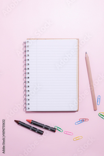 School supplies on a colorful background. Back to school background. Brushes, watercolors, pencils, ballpoint pens