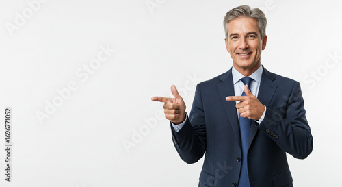 Confident businessman in suit pointing to the side, inviting action and opportunity for your next project