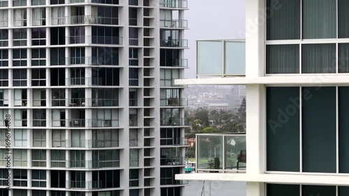 Aerial view of iconic beachfront condominiums in Coronado, California on a sunny day with blue sky