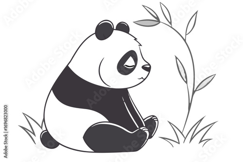 Sad panda sitting in grass with bamboo