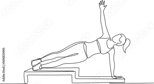 Woman performing a side plank exercise on a step for a strong core workout