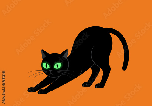Stretching Black Cat with Bright Green Eyes.