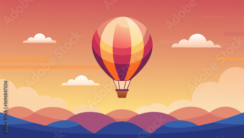 Hot air balloon flying over colorful hills during sunset with scenic sky and clouds