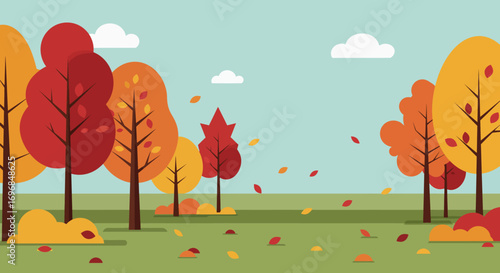 autumn trees shedding leaves under a clear blue sky