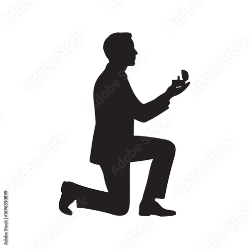 Silhouette of a Man Kneeling and Proposing