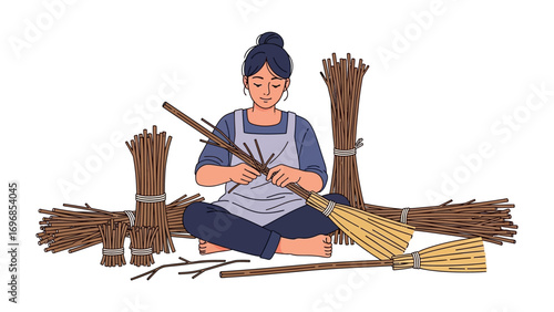Crafting Dreams: An artisan meticulously weaves twigs into a traditional broom, celebrating heritage and handmade craftsmanship. Embrace the elegance and artistry of this moment.