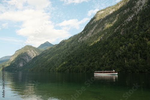lake in the mountains with a boat, Königssee