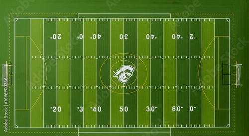 Aerial View of a Football Field with Yard Lines and Logos