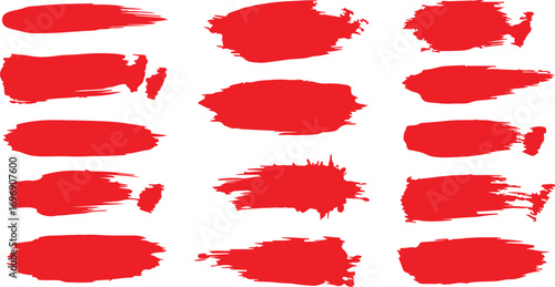 Collection of red paint brush strokes and splatters on white background