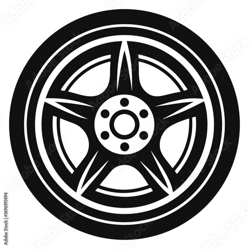 Black and White Image of a Car Tire with a Star Design Rim