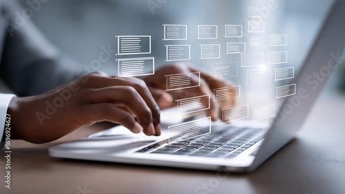 Hands typing on a laptop while digital documents appear, showcasing technology use in a modern workspace