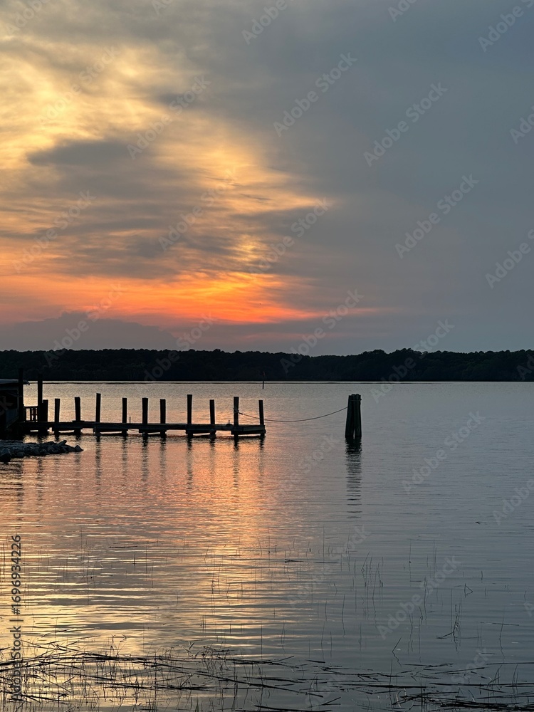 Fototapeta premium Hilton Head Sunset Over Ocean with Water Posts