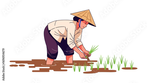 Harmony in the Rice Paddy: A lone farmer, clad in traditional attire, diligently cultivates a vibrant field, embodying the enduring spirit of agriculture. 