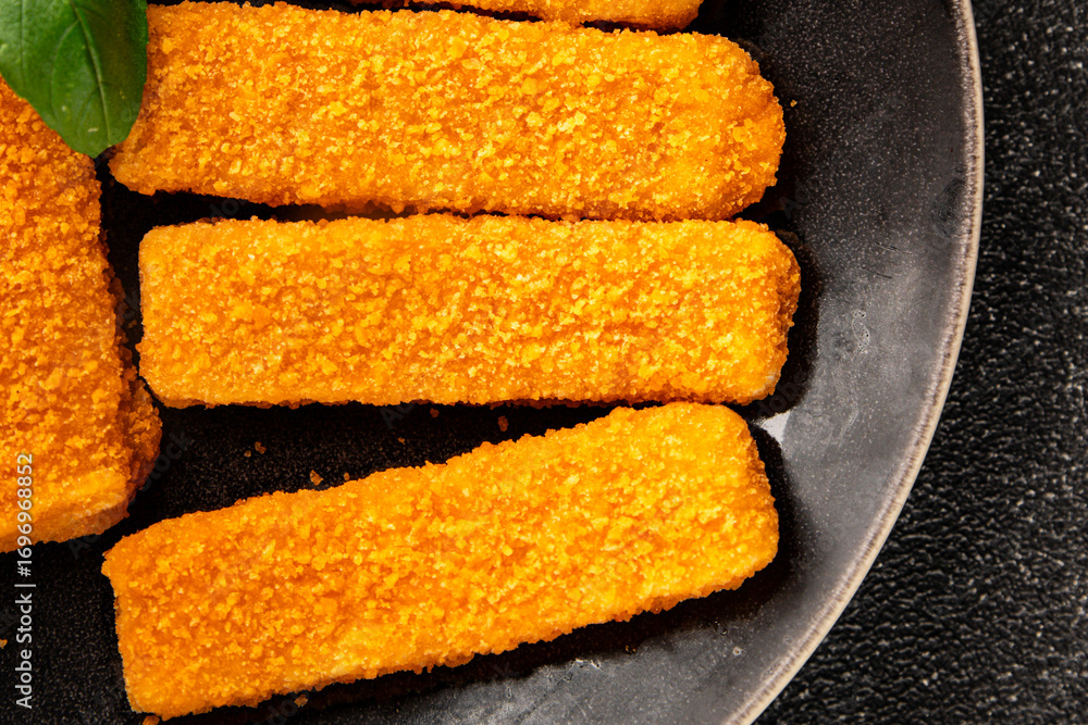 Fototapeta premium Fish stick seafood fish mince second course tasty snack fresh delicious gourmet food background on the table rustic food top view copy space pescetarian diet