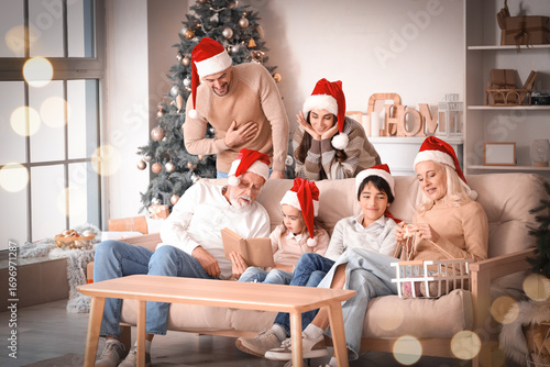 Big family in Santa hats at...